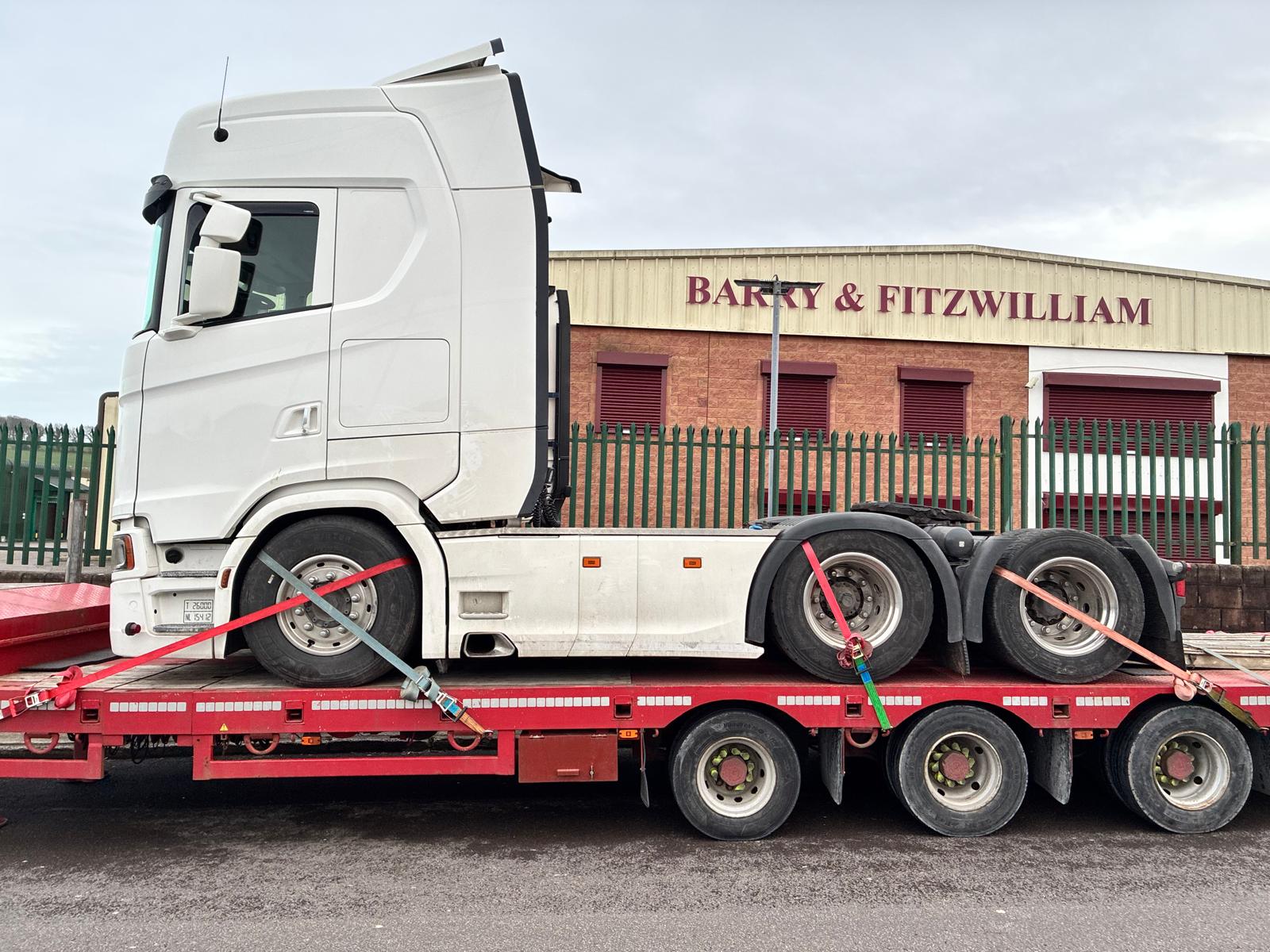 Truck transporting a vehicle