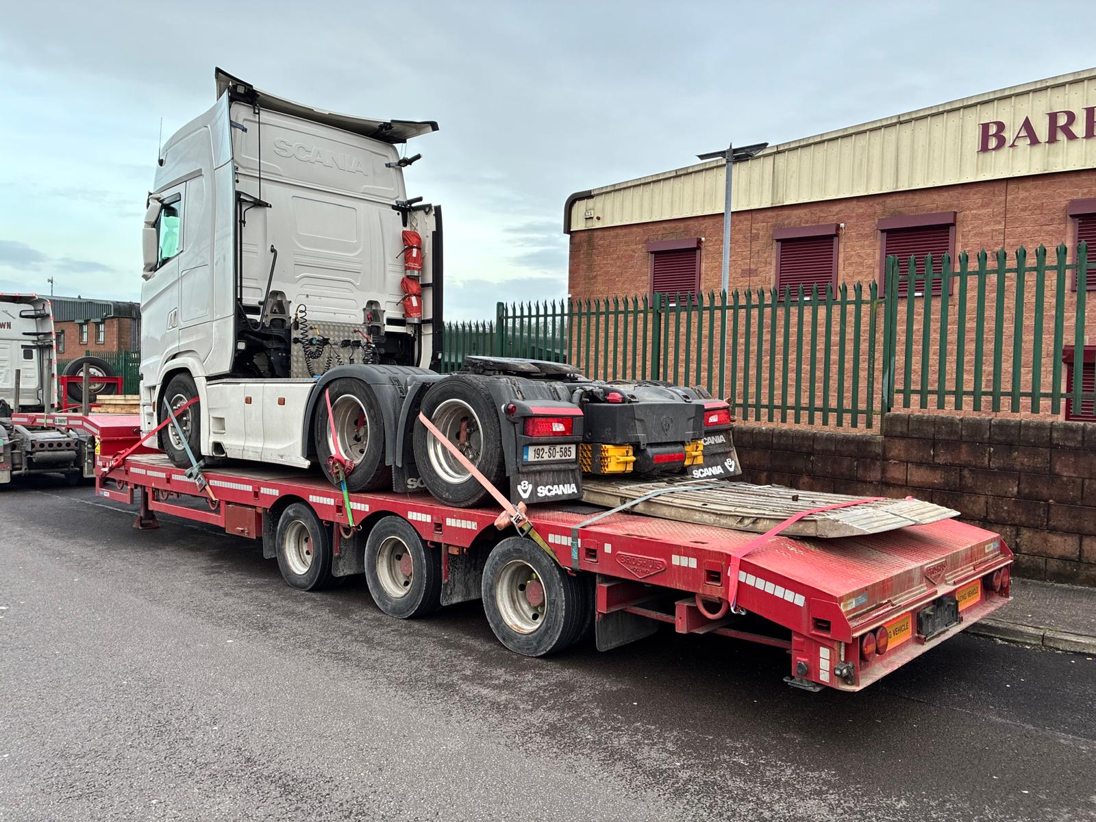 Truck transporting machinery