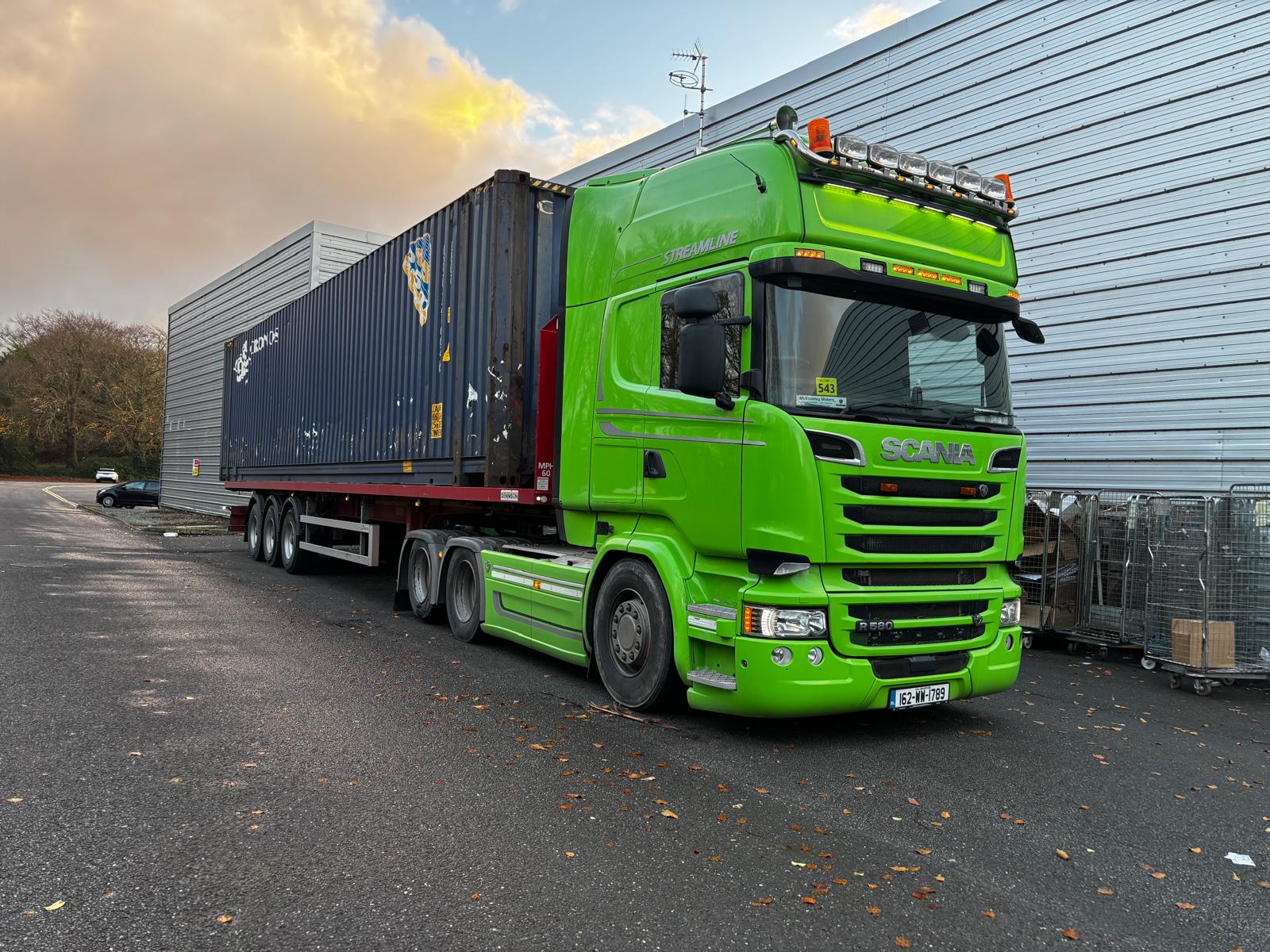 Green truck on the road